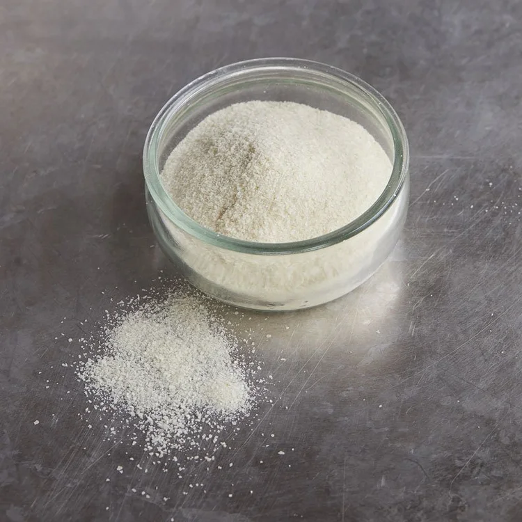 Food-grade potato granules in a glass bowl